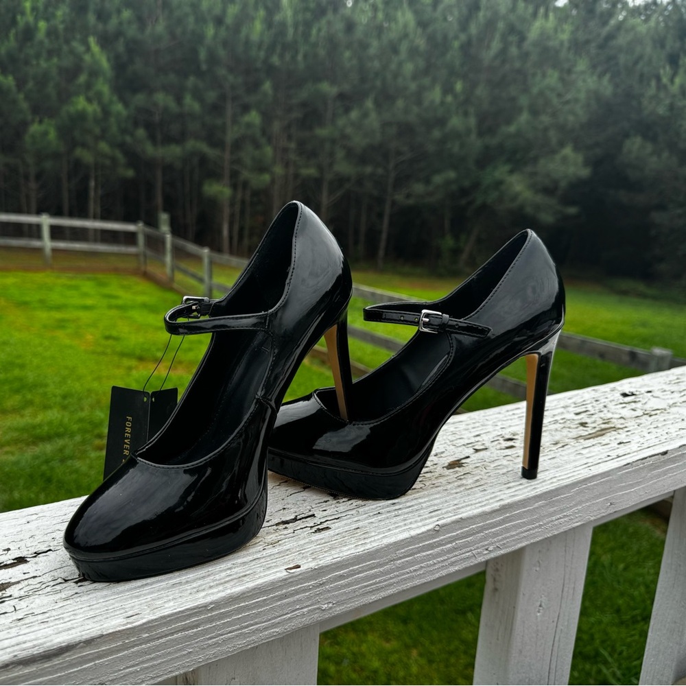 Very sexy ankle strap patent leather stilettos.